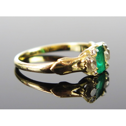 161 - An Emerald and Old Cut Diamond Ring, the central c. 6x4.2mm stone flanked by three diamonds to each ... 