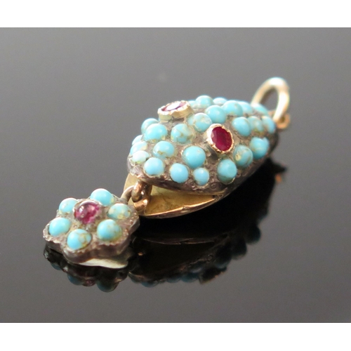 166 - An Antique Turquoise Mounted Snake Head Pendant with ruby eyes and in an unmarked high carat gold se... 