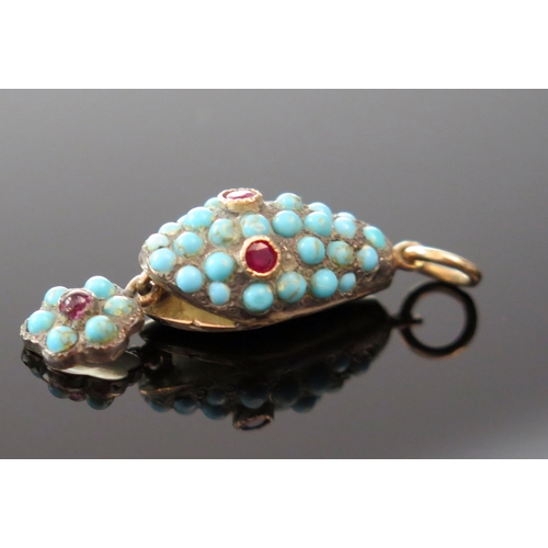 166 - An Antique Turquoise Mounted Snake Head Pendant with ruby eyes and in an unmarked high carat gold se... 