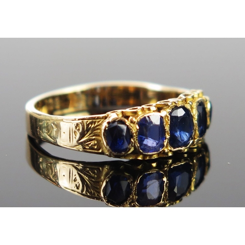 169 - A 15ct Gold and Sapphire Ring (two stones replaced with paste), size M.5, 2.3g