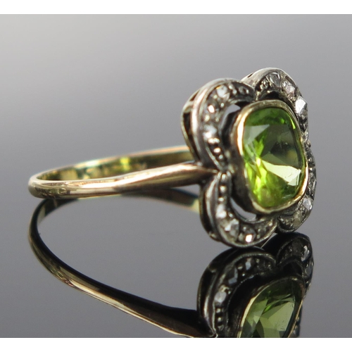 171 - An Antique Peridot and Rose Cut Diamond Ring in a gold setting (marks rubbed), the central c. 6.8x6,... 