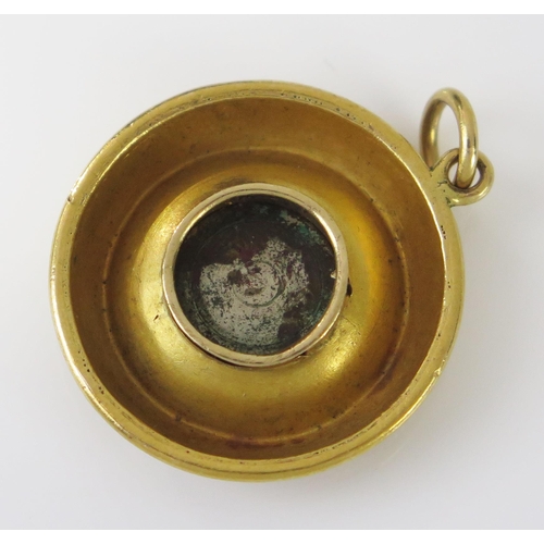 177 - An Unmarked 15ct Gold Shield Pendant with a central micromosaic cartouche decorated with cupid, 37.5... 