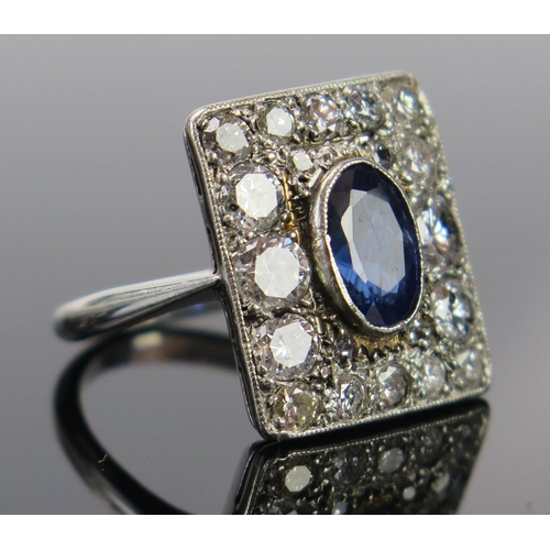 185 - An Art Deco Sapphire and Diamond Ring in a precious white metal setting, the central  c. 8x5.4mm ova... 