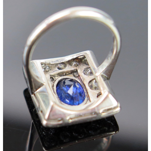 185 - An Art Deco Sapphire and Diamond Ring in a precious white metal setting, the central  c. 8x5.4mm ova... 