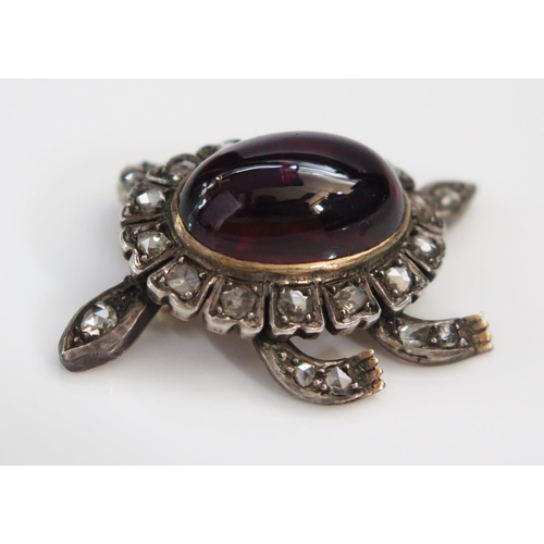 192 - A Victorian cabochon garnet and rose cut diamond articulated en trembler brooch in the form of a ter... 