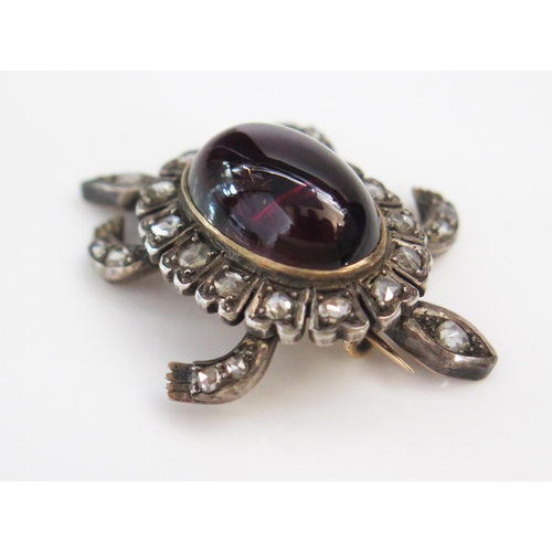 192 - A Victorian cabochon garnet and rose cut diamond articulated en trembler brooch in the form of a ter... 