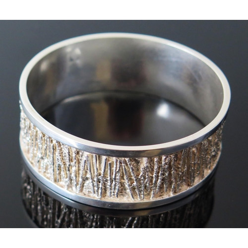 206 - Graham Watling Silver Bangle, London 1975, 25mm wide, 66.5mm inside diam., 92g