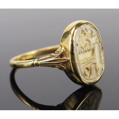 289 - An 18ct Gold Seal Ring Mounted with a possibly antiquarian matrix, 17x13mm head, size U, 5g