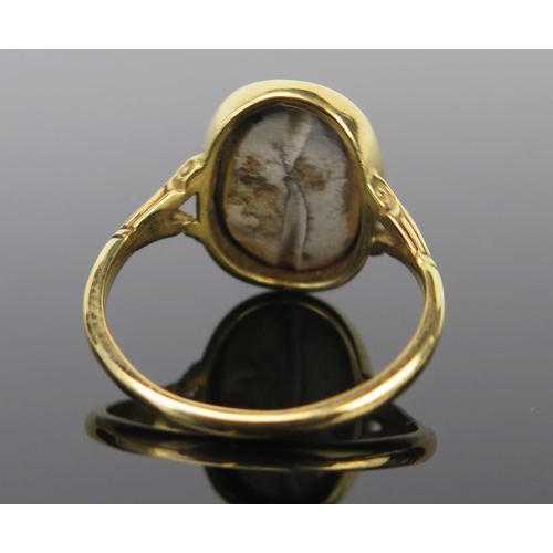 289 - An 18ct Gold Seal Ring Mounted with a possibly antiquarian matrix, 17x13mm head, size U, 5g