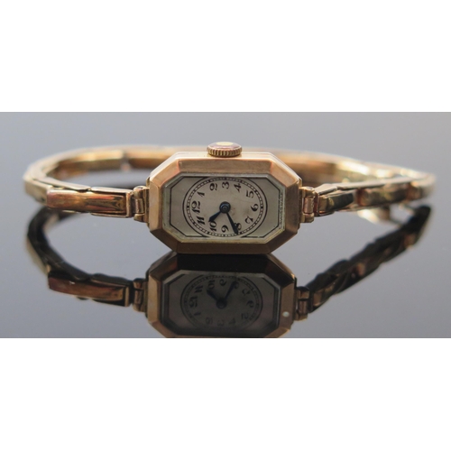 403 - A 9ct Gold Cased Ladies Wristwatch on 9ct gold spring loaded bracelet, 21x14mm case with Swiss made ... 