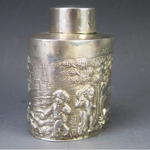 509 - A Victorian silver tea caddy and lid, maker's mark worn, Chester, 1899, of oval outline with repouss... 