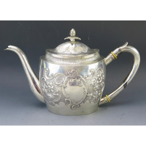 514 - A George III silver teapot, maker John Robins, London, 1802, of oval form, the domed hinged lid with... 