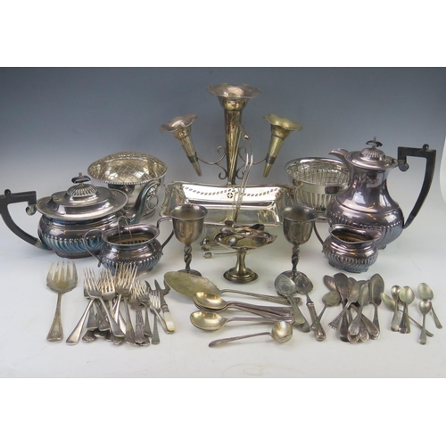 523 - A quantity of assorted plated wares, includes; four piece tea service with half reeded decoration, e... 