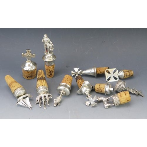 534 - A collection of English and continental silver and plated bottle stoppers, modelled as galleon, wind... 