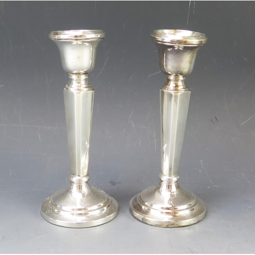 539 - A pair of George VI silver candlesticks, makers mark worn, Birmingham, 1949, with urn shaped sconces... 