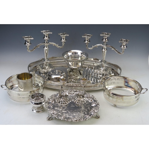 548 - A mixed collection of silver plated wares including a pair of twin branch candelabra, oval serving t... 