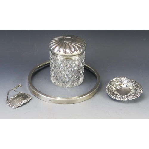 554 - A mixed collection of silverwares, various makers and dates, includes, clear glass and silver mounte... 