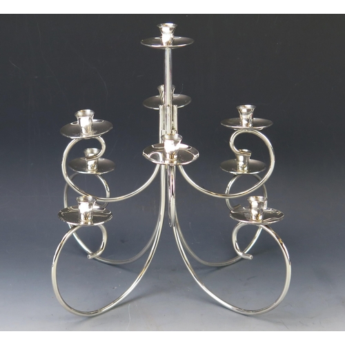 556 - A Gorham modernist silver plated nine light dual purpose candelabra, on swept branches with urn-shap... 