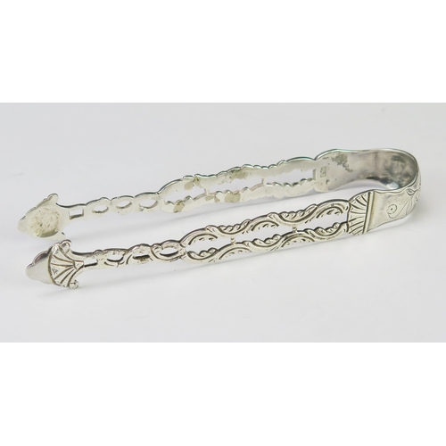 572 - A pair of Georgian silver sugar tongs, maker I.M possibly John Muns, monogrammed, with pierced folia... 