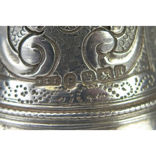 574 - A continental silver call bell, in the form of a woman in a hooped dress, bears import marks for She... 