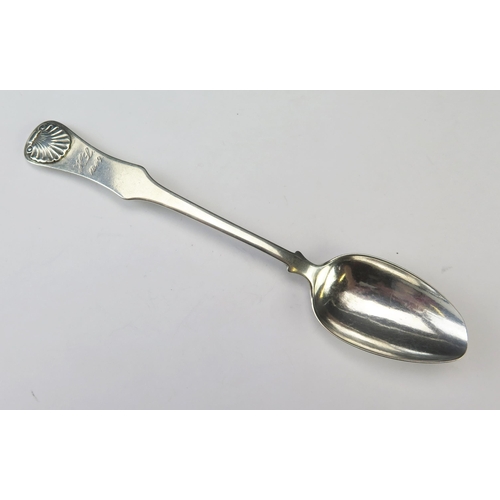 579 - A Continental silver probably Austrian silver fiddle and shell pattern dessert spoon, maker NH, init... 