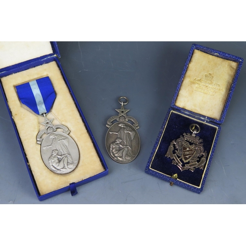 581 - Two silver Masonic Hospital jewels, one contained in its original case with ribbon, together with an... 