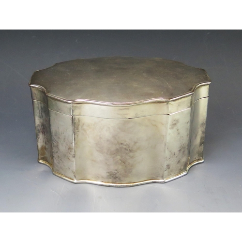 587 - A silver plated casket, of cartouche-shaped outline, with shallow domed hinged lid, and gadrooned ri... 