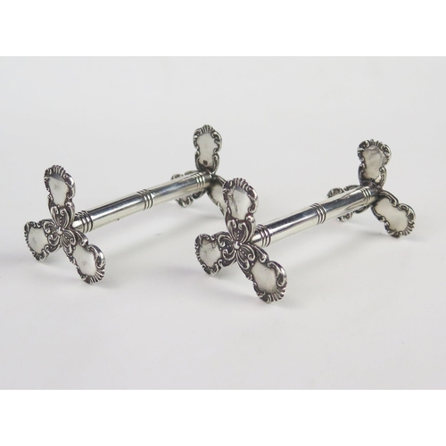 597 - A pair of Edward VII silver knife rests, maker Henry Wigfull, Sheffield, 1909, of traditional design... 