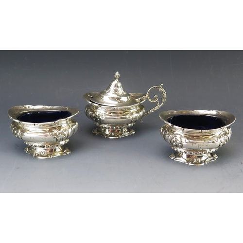 598 - A Victorian silver three-piece condiment set, maker Barker Brothers, Birmingham, 1899, of campagna f... 