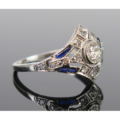 61 - An Art Deco Sapphire and Diamond Ring in an unmarked precious white metal setting, the central c. 4.... 