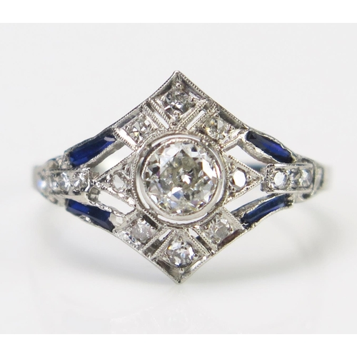 61 - An Art Deco Sapphire and Diamond Ring in an unmarked precious white metal setting, the central c. 4.... 