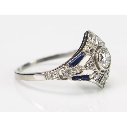 61 - An Art Deco Sapphire and Diamond Ring in an unmarked precious white metal setting, the central c. 4.... 