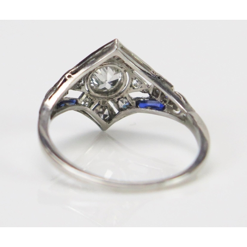 61 - An Art Deco Sapphire and Diamond Ring in an unmarked precious white metal setting, the central c. 4.... 