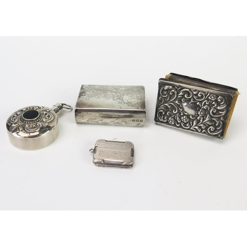 626 - A collection of silver wares, includes matchbox holders, locket and scent bottle