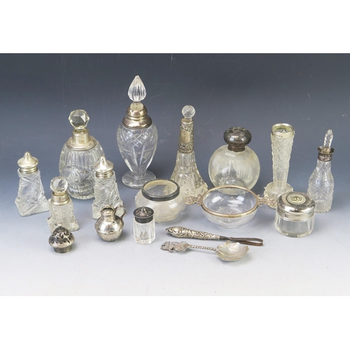 640 - A collection of clear glass and silver scent bottles, vases condiments, some silver plate mounted, e... 