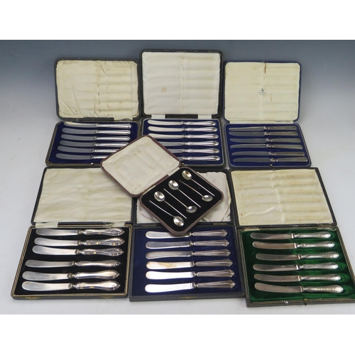 641 - A collection of silver handled butter knives, most cased, six silver coffee spoons, and cased plated... 