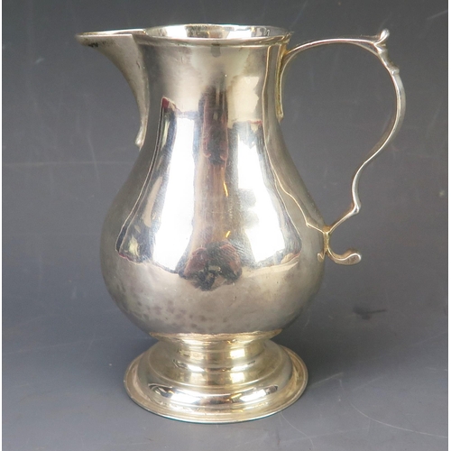 649 - A George II silver cream jug, maker Dinah Gamon, London, 1739, of baluster form, with scroll handle,... 