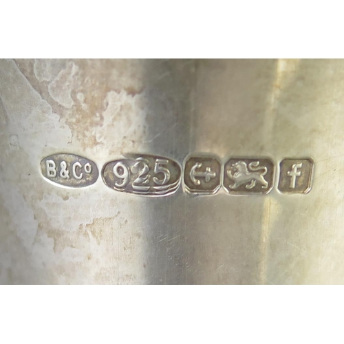 653 - An Elizabeth II silver double ended spirit measure, maker W I Broadway & Co, Birmingham, 2005, with ... 