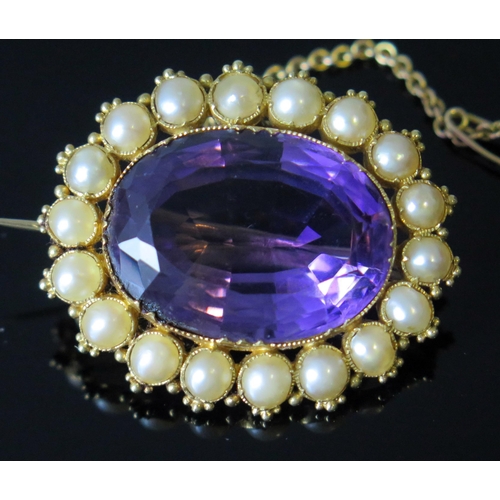 7 - A Victorian Amethyst and Pearl (untested) Brooch in an unmarked gold setting with safety chain, 35x3... 