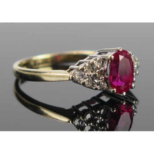 71 - A 9ct Gold, Ruby and Diamond Ring, the c. 7x5mm stone claw set, full London hallmarks, size M, 2.7g