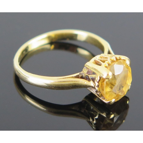 72 - A Citrine Single Stone Ring in an unmarked gold setting, c. 8.2mm claw set, size L, 3.8g