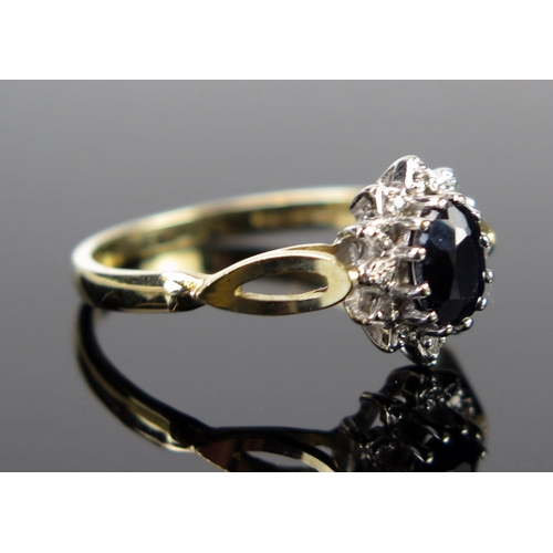 73 - A 9ct Gold, Sapphire and Diamond Cluster Ring, full London hallmarks, 10x8mm head, size N.75, 2.1g