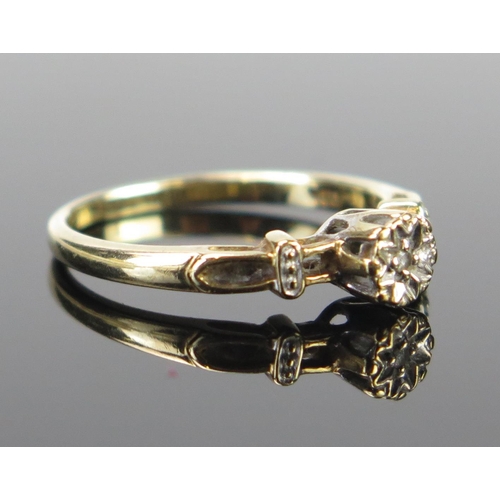 74 - A 9ct Gold and Diamond Solitaire Ring, illusion set, size L.5, 1.7g. Sold in heart shaped ring box