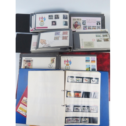 901 - A collection of British and world stamps, mostly British First Day Covers, contained in albums, some... 