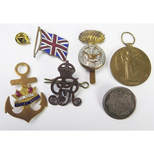 911 - A collection of patriotic pins, WWI Victory Medal , cap badges etc.