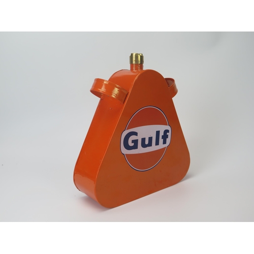 915 - A repainted replica Gulf petrol can with brass can, 24cm high.