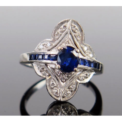 93 - An Art Deco Style 18ct White Gold, Sapphire and Diamond Ring, the central oval cut claw set stone su... 