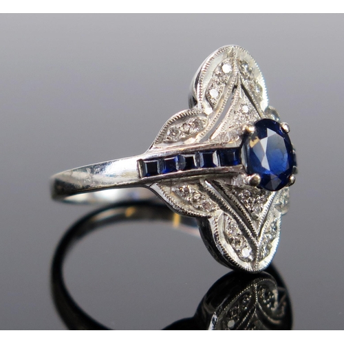 93 - An Art Deco Style 18ct White Gold, Sapphire and Diamond Ring, the central oval cut claw set stone su... 