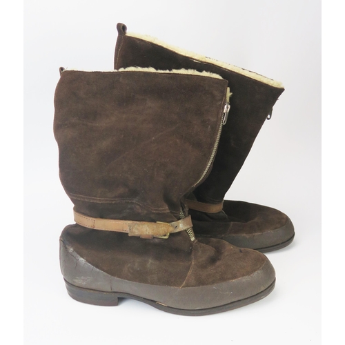 937A - A pair of sheepskin lined flying boots, with zip fronts and tightening strap.