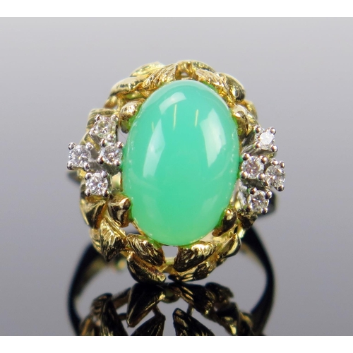 94 - An 18ct Gold, Chrysoprase and Diamond Dress Ring, the 14x9x5mm central cabochon stone surrounded by ... 